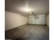 Spacious garage with an automatic door at 12547 W Pasadena Ave, Litchfield Park, AZ 85340