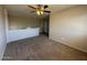 Cozy living area with neutral carpeting and a partial view of the upper floor at 12547 W Pasadena Ave, Litchfield Park, AZ 85340