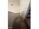 Carpeted staircase providing easy access to different levels, complemented by neutral decor and handrails at 12547 W Pasadena Ave, Litchfield Park, AZ 85340