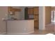 Kitchen area with tile flooring, breakfast bar, wood cabinetry and stainless steel appliances at 1412 E Oakland St, Gilbert, AZ 85295