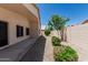 Gravel backyard featuring beautiful greenery and covered patio area at 14672 W Whitton Ave, Goodyear, AZ 85395