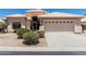 Charming single story home with a two car garage and a well kept xeriscaped front yard at 14672 W Whitton Ave, Goodyear, AZ 85395