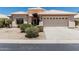 Charming single story home with a two car garage and a well kept xeriscaped front yard at 14672 W Whitton Ave, Goodyear, AZ 85395