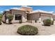 Charming single story home with a two car garage and a well kept xeriscaped front yard at 14672 W Whitton Ave, Goodyear, AZ 85395