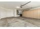Spacious garage offers plenty of storage cabinets and room for parking at 14672 W Whitton Ave, Goodyear, AZ 85395