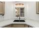 Close up of the kitchen sink featuring a stylish faucet and modern countertop at 14672 W Whitton Ave, Goodyear, AZ 85395