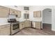 Modern kitchen with stainless steel appliances, cabinets and marble countertops at 14672 W Whitton Ave, Goodyear, AZ 85395