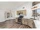 Bright kitchen featuring stainless steel appliances, wood floors, and a modern countertop at 14672 W Whitton Ave, Goodyear, AZ 85395