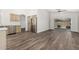 Bright living room with view to the kitchen, stainless steel fridge and backyard access at 14672 W Whitton Ave, Goodyear, AZ 85395