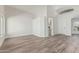Spacious living room featuring new flooring, vaulted ceilings, and an arched entryway at 14672 W Whitton Ave, Goodyear, AZ 85395