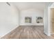 Spacious living room featuring new flooring, vaulted ceilings, and an arched entryway at 14672 W Whitton Ave, Goodyear, AZ 85395