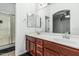 Spacious bathroom featuring a double vanity, updated fixtures, and a separate shower, designed for convenience at 15515 N 165Th Ave, Surprise, AZ 85388