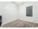 Bright, minimalist bedroom with a large window, providing ample natural light and a clean, inviting space at 15515 N 165Th Ave, Surprise, AZ 85388