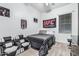 Comfortable bedroom featuring a cozy bed, natural light, and sporty decor, ideal for relaxation and personalization at 15515 N 165Th Ave, Surprise, AZ 85388