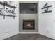 Contemporary fireplace wall with floating shelves, perfect for adding a touch of modern elegance to the room at 15515 N 165Th Ave, Surprise, AZ 85388