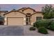 Charming single-story home features neutral stucco, well-maintained landscaping, and an attached two-car garage at 15515 N 165Th Ave, Surprise, AZ 85388