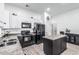 This modern kitchen features stainless steel appliances, granite countertops, and an eat-in island for casual dining at 15515 N 165Th Ave, Surprise, AZ 85388