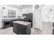 Modern kitchen featuring granite countertops, stainless steel appliances, and a center island at 15515 N 165Th Ave, Surprise, AZ 85388