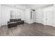Inviting living room boasts wood floors, a cozy couch, and a bright atmosphere perfect for relaxation at 15515 N 165Th Ave, Surprise, AZ 85388