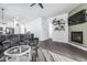Bright living room showcases wood floors, fireplace, and seamless transitions into the kitchen and dining areas at 15515 N 165Th Ave, Surprise, AZ 85388