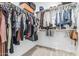Organized walk-in closet providing ample storage space with shelves and hanging rods, keeping items neatly arranged at 15515 N 165Th Ave, Surprise, AZ 85388