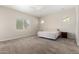 Large bedroom offers soft carpet, neutral walls, and a comfortable bed for a tranquil retreat at 16860 W Soft Wind Dr, Surprise, AZ 85387