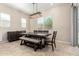 An inviting dining room featuring a modern light fixture and a stylish table with bench seating at 16860 W Soft Wind Dr, Surprise, AZ 85387