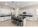 Spacious kitchen featuring a center island with barstool seating, white cabinets, and modern appliances at 16860 W Soft Wind Dr, Surprise, AZ 85387