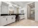 Well-lit main bathroom with dual sinks, granite countertops, and lots of vanity space at 16860 W Soft Wind Dr, Surprise, AZ 85387
