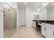 Bright main bathroom with a glass shower, dual sinks, and vanities with countertop space at 16860 W Soft Wind Dr, Surprise, AZ 85387