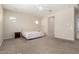 Spacious main bedroom featuring neutral walls, carpeted flooring, and a ceiling fan at 16860 W Soft Wind Dr, Surprise, AZ 85387