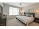 Comfortable bedroom featuring neutral tones, modern furnishings, and a serene, relaxing ambiance at 16935 W Sheridan St, Goodyear, AZ 85395