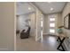 This living room connects to the home's entry and the home office, offering a calm, modern vibe at 16935 W Sheridan St, Goodyear, AZ 85395