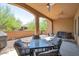 Spacious outdoor patio area with comfortable seating and ceiling fans for a relaxing atmosphere at 16935 W Sheridan St, Goodyear, AZ 85395