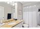 A full bathroom featuring an oval sink, vanity, and shower-tub combo at 1701 E Colter St # 443, Phoenix, AZ 85016