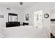 Bright bedroom featuring an ensuite bathroom and black wood dresser at 1701 E Colter St # 443, Phoenix, AZ 85016