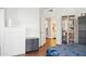 Bedroom with wood floors, and view of the ensuite bathroom and storage at 1701 E Colter St # 443, Phoenix, AZ 85016