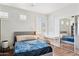 Bedroom with windows, hardwood floors, and a built-in desk space at 1701 E Colter St # 443, Phoenix, AZ 85016