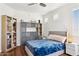 Bedroom featuring hardwood floors, a ceiling fan, and a cozy rug at 1701 E Colter St # 443, Phoenix, AZ 85016