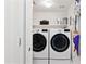 Convenient laundry room featuring modern, stacked, front-loading washer and dryer at 1701 E Colter St # 443, Phoenix, AZ 85016