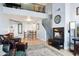 Open-concept living space with a cozy fireplace and a view of the upper level at 1701 E Colter St # 443, Phoenix, AZ 85016
