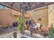 Outdoor patio featuring an elegant chandelier, fire pit, and comfortable seating at 1786 S Seton Ave, Gilbert, AZ 85295