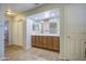Spacious bathroom with a double vanity, mirror, and neutral tones at 1786 S Seton Ave, Gilbert, AZ 85295