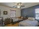 Cozy bedroom with two beds, natural light, and warm wood flooring at 1786 S Seton Ave, Gilbert, AZ 85295