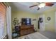 Bedroom with a ceiling fan, dresser, and a decorative interior with a lot of natural light at 1786 S Seton Ave, Gilbert, AZ 85295