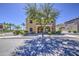 Charming two-story home with desert landscaping, covered porch, and well-maintained bushes at 1786 S Seton Ave, Gilbert, AZ 85295