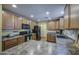 A bright kitchen boasts modern appliances, plenty of counter space, and natural wood cabinets at 1786 S Seton Ave, Gilbert, AZ 85295