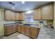 Beautiful kitchen with a sink, window, and stainless steel appliances at 1786 S Seton Ave, Gilbert, AZ 85295