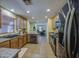 Modern kitchen featuring a sink, stainless steel appliances, and wood cabinets at 1786 S Seton Ave, Gilbert, AZ 85295