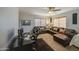 Relaxing living area with a leather sofa, workspace, and stylish decor creating a welcoming ambiance at 1786 S Seton Ave, Gilbert, AZ 85295